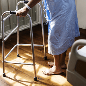 Hospital patient using a walking frame